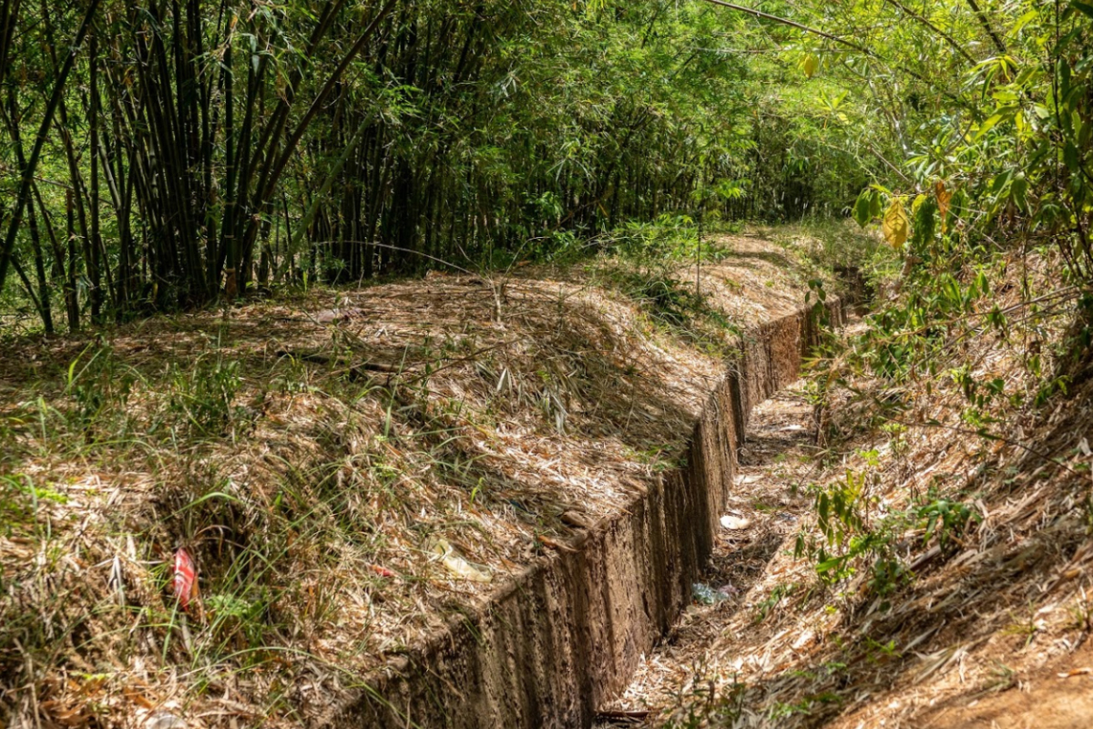 Inside Vinh Moc Tunnels with dim lighting and narrow passageways